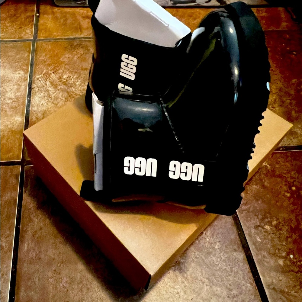 Black/ white girls' Uggs size 12. Never put on with tags